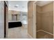 Main bathroom featuring dual sinks, vanity, and a separate tub and shower at 7963 Cape Brett St, Las Vegas, NV 89131