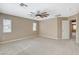 Spacious main bedroom with plush carpeting, a modern ceiling fan, and neutral paint at 7963 Cape Brett St, Las Vegas, NV 89131