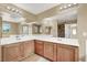 Bright bathroom offering dual sinks, large mirrors, and modern lighting at 8015 Maple Park St, Las Vegas, NV 89131