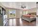 Primary bedroom featuring a king bed, a ceiling fan, laminate floors, and access to a balcony at 8015 Maple Park St, Las Vegas, NV 89131