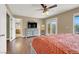 Bedroom featuring a flatscreen tv, dresser, and access to an outdoor balcony at 8015 Maple Park St, Las Vegas, NV 89131