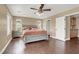 Comfortable bedroom with ceiling fan and wood-look flooring at 8015 Maple Park St, Las Vegas, NV 89131