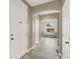 Hallway showcasing arched entryway to a room with a seating area and natural light at 8015 Maple Park St, Las Vegas, NV 89131
