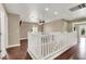 View of the second-floor hallway with a white banister and wood floors at 8015 Maple Park St, Las Vegas, NV 89131