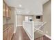 Upper hallway featuring wood laminate floors and storage cabinets at 8015 Maple Park St, Las Vegas, NV 89131