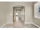 Hallway with a series of arched doorways and a glimpse into adjoining rooms at 8015 Maple Park St, Las Vegas, NV 89131