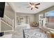 Open-concept living room with tile flooring, white seating, and easy access to other areas of the home at 8015 Maple Park St, Las Vegas, NV 89131