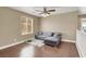 Sitting area with a gray sofa, neutral walls, a window, and laminate flooring at 8015 Maple Park St, Las Vegas, NV 89131