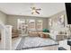 Bright living room with neutral-toned decor, a plush sectional sofa, and tile flooring at 8015 Maple Park St, Las Vegas, NV 89131