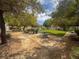 Community park with bench and picnic table under mature trees at 8015 Maple Park St, Las Vegas, NV 89131