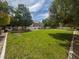 Open community park with large grassy area, bench, and picnic table at 8015 Maple Park St, Las Vegas, NV 89131