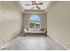 Sitting room featuring a large arched window, neutral walls, and tile floors at 8015 Maple Park St, Las Vegas, NV 89131