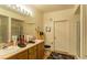 Bathroom featuring double sinks, a walk-in shower, with neutral tiling and modern fixtures throughout at 8777 Maule Ave # 3116, Las Vegas, NV 89148