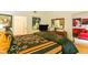 Tastefully decorated bedroom with open doorway to ensuite bathroom and living room with comfortable furnishings at 8777 Maule Ave # 3116, Las Vegas, NV 89148