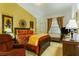 Comfortable bedroom with warm colors, decorative wall art, a large window and neutral carpet flooring at 8777 Maule Ave # 3116, Las Vegas, NV 89148