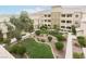 Spacious condo complex features a manicured courtyard with lush landscaping and walkways at 8777 Maule Ave # 3116, Las Vegas, NV 89148