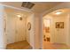 Inviting entryway with tile flooring, arched doorways, and access to the bathroom for convenience at 8777 Maule Ave # 3116, Las Vegas, NV 89148