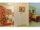 Hallway view showcasing the bathroom with tropical themed decor and a glimpse into the bedroom space at 8777 Maule Ave # 3116, Las Vegas, NV 89148