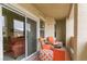 Cozy covered patio with outdoor seating, an orange rug, and sliding glass doors at 8777 Maule Ave # 3116, Las Vegas, NV 89148