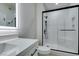 Modern bathroom with tiled shower, glass door, and sleek vanity with a backlit mirror at 9050 W Warm Springs Rd # 1117, Las Vegas, NV 89148