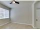 Neutral bedroom featuring a ceiling fan, window with blinds, and tiled floors at 9050 W Warm Springs Rd # 1117, Las Vegas, NV 89148