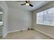 Bedroom featuring a window with blinds and an open bathroom area at 9050 W Warm Springs Rd # 1117, Las Vegas, NV 89148