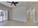 Bedroom featuring tile floors, natural light, and access to the outdoor patio at 9050 W Warm Springs Rd # 1117, Las Vegas, NV 89148