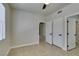 Bedroom showcases a window with blinds and double doors leading to other rooms at 9050 W Warm Springs Rd # 1117, Las Vegas, NV 89148