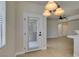 View of the dining area with tile floors and a door to the outside at 9050 W Warm Springs Rd # 1117, Las Vegas, NV 89148