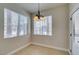 Dining area featuring tile flooring, natural light, and a modern chandelier at 9050 W Warm Springs Rd # 1117, Las Vegas, NV 89148