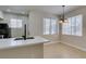 Bright dining area features tiled floor and modern lighting fixture at 9050 W Warm Springs Rd # 1117, Las Vegas, NV 89148