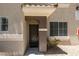 Front entrance with a covered porch and small garden area, and a view of the unit number at 9050 W Warm Springs Rd # 1117, Las Vegas, NV 89148