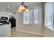 Modern kitchen with breakfast nook, featuring updated appliances and a chandelier at 9050 W Warm Springs Rd # 1117, Las Vegas, NV 89148