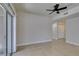 Open-concept living area with sliding glass doors and a contemporary ceiling fan at 9050 W Warm Springs Rd # 1117, Las Vegas, NV 89148