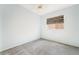 Carpeted bedroom featuring natural lighting through a window with modern blinds at 940 Rifle Dr, Henderson, NV 89002