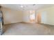 Spacious carpeted bedroom with neutral walls and adjoining bathroom and closet at 940 Rifle Dr, Henderson, NV 89002