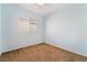 Bright bedroom with soft blue walls, carpeted floors, and a window offering natural light at 940 Rifle Dr, Henderson, NV 89002