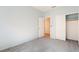 Bedroom boasts light blue walls, carpeted floors and a double door closet with wood trim at 940 Rifle Dr, Henderson, NV 89002