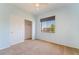 Bedroom with carpeted floor and natural light filtering through the window with blinds at 940 Rifle Dr, Henderson, NV 89002