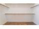Bright closet features carpet and wooden shelving for optimal storage capacity at 940 Rifle Dr, Henderson, NV 89002