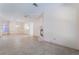 Spacious living room featuring neutral walls, tile flooring, and a fireplace for a cozy atmosphere at 940 Rifle Dr, Henderson, NV 89002