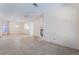 Spacious living room featuring neutral walls, tile flooring, and a fireplace for a cozy atmosphere at 940 Rifle Dr, Henderson, NV 89002