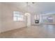 Bright and airy living room with tile flooring, fireplace, and archway to another room at 940 Rifle Dr, Henderson, NV 89002