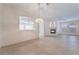 Bright and airy living room with tile flooring, fireplace, and archway to another room at 940 Rifle Dr, Henderson, NV 89002