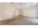 A comfortable primary bedroom with neutral walls, plush carpeting, and an ensuite bathroom for added convenience at 940 Rifle Dr, Henderson, NV 89002