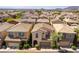 An aerial view of a residential neighborhood with neatly arranged homes and landscaping at 10229 Mayflower Bay Ave, Las Vegas, NV 89166
