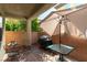 This patio area offers a cozy space with outdoor seating and a grill for gatherings at 10229 Mayflower Bay Ave, Las Vegas, NV 89166