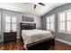 Vaulted ceiling bedroom with wood floors, plantation shutters, and a ceiling fan at 10229 Mayflower Bay Ave, Las Vegas, NV 89166