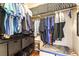 Well-organized walk-in closet with shelving, hanging space and wood-look floors at 10229 Mayflower Bay Ave, Las Vegas, NV 89166