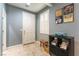 Inviting entryway with tiled flooring, shuttered window and decorative accents at 10229 Mayflower Bay Ave, Las Vegas, NV 89166